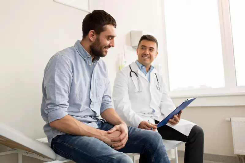 man talking to doctor about ed