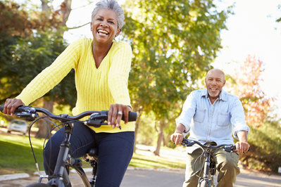 older couple riding bikes around the neighborhood
